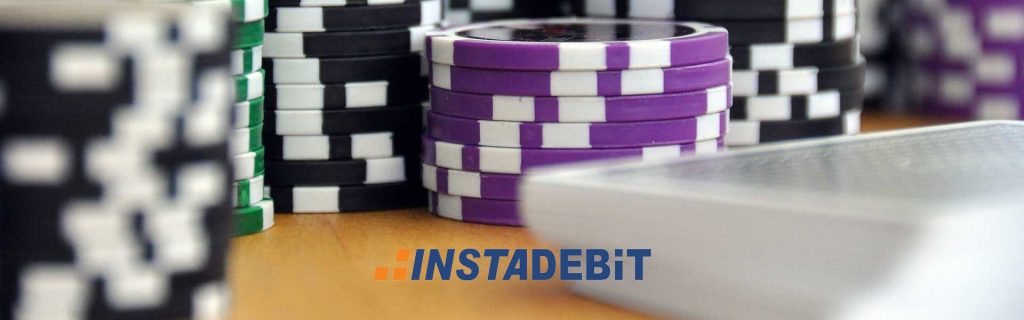 Instadebit Casino logo on chips and poker cards